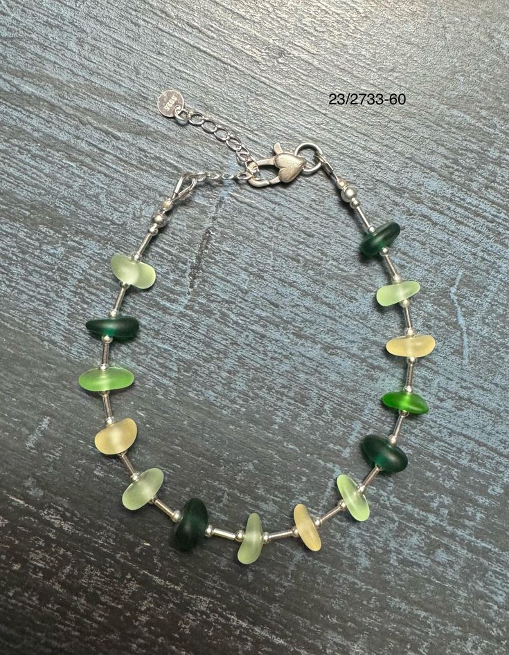 This bracelet is made with genuine sea glass and sterling silver. The sea glass has lovely shades of green. Elegant Green Sea Glass Jewelry, Ocean-inspired Sea Glass Jewelry For Jewelry Making, Nickel-free Sea Glass Jewelry For Jewelry Making, Sea Glass Jewelry Sandyfeat Enterprises Inc., Adjustable Ocean-inspired Sea Glass Jewelry, Green Beach, Sterling Silver Bracelet, Beach Glass, Sterling Silver Bracelets