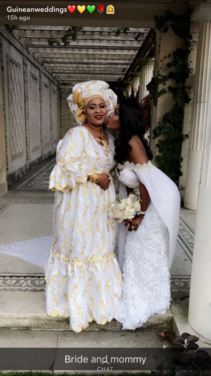 two women dressed in white and yellow posing for a photo on their wedding day with the caption bride and mommy