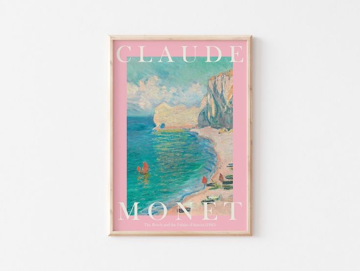 a pink poster hanging on the wall next to a white wall with an ocean scene