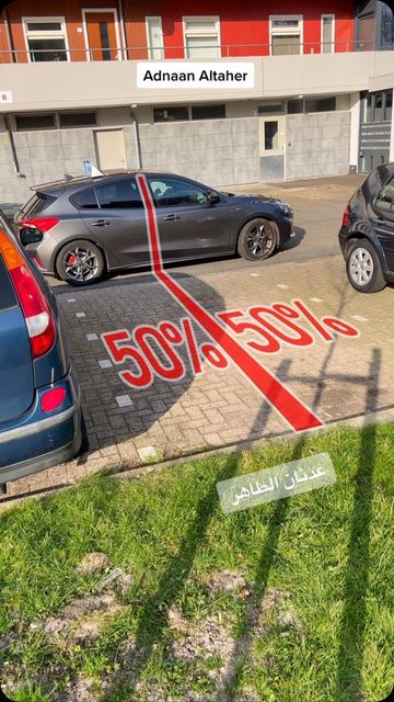 an image of cars parked in front of a building with the word 500 % less written on it