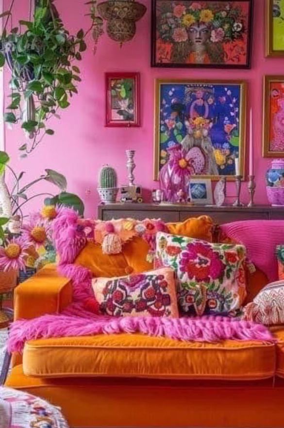 a living room filled with lots of colorful furniture and pictures on the wall above it