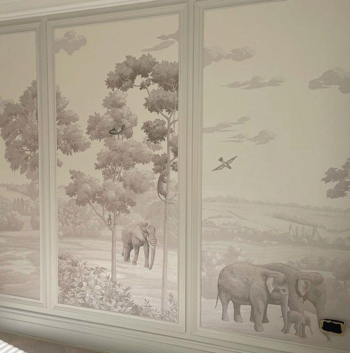 an elephant mural is painted on the wall in a bedroom with white walls and flooring