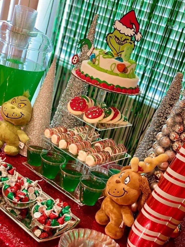 a table topped with lots of desserts and candy