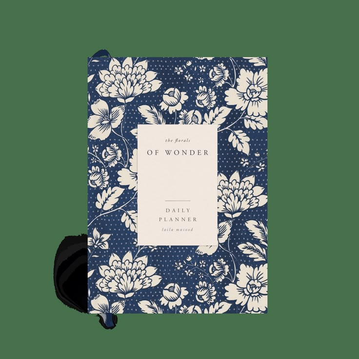 a blue and white book with flowers on it, the front cover is open to reveal an