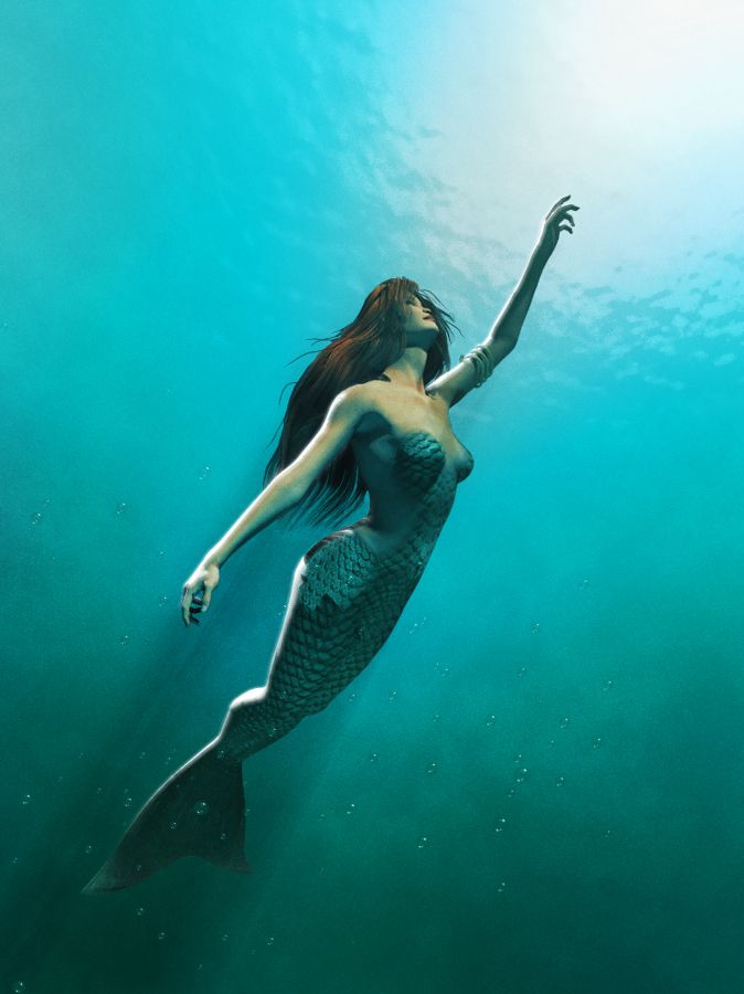 a woman is swimming in the water with her arms out to catch something while wearing a fish tail