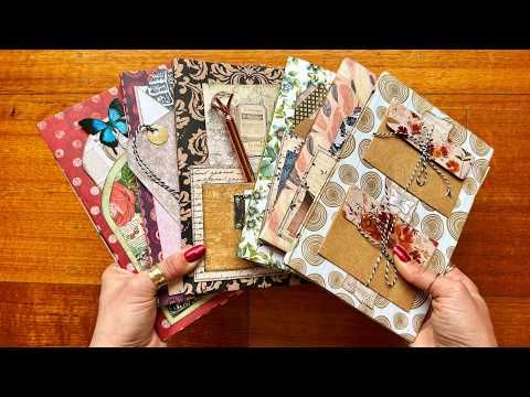 a person is holding several different types of scrapbooks on a wooden table with wood flooring