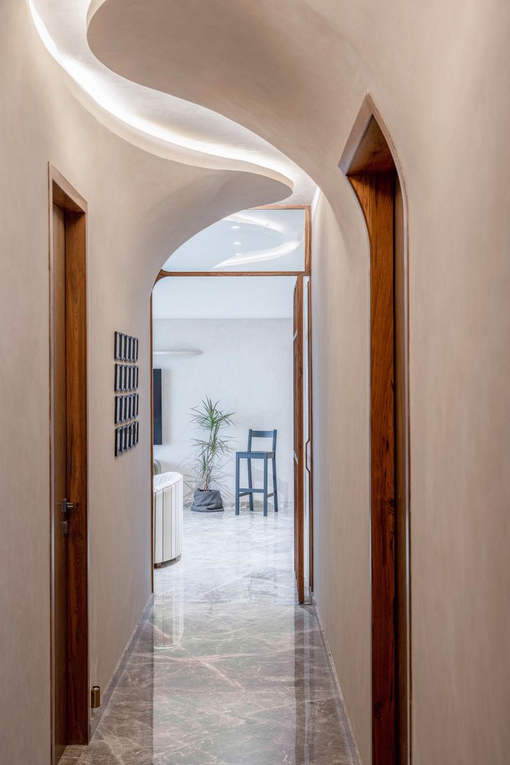 an archway leading to a living room and dining area