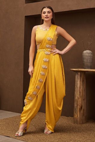 Yellow pre-stitched drape with floral vintage embroidered motifs. Paired with a padded blouse with motif embroidered neckline and belt. Comes along with a dhoti pant. - Aza Fashions Haldi Ceremony Outfit Indowestern, Dhoti Pants Outfit, Dhoti Dresses For Women, Embroidery Sunflower, Papa Don't Preach, Saree Gowns, Haldi Dress, Dhoti Saree, Cotton Sarees Handloom