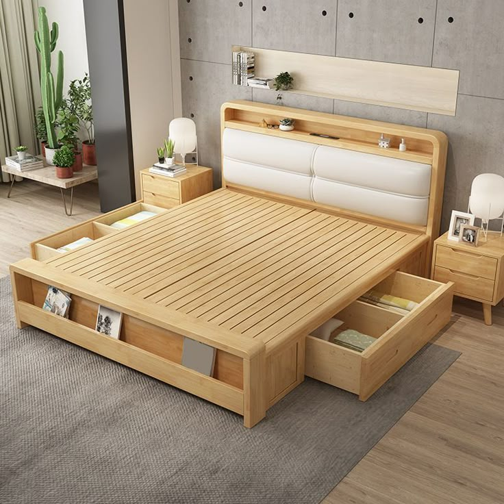 a wooden bed with drawers underneath it in a room next to a plant and potted plants