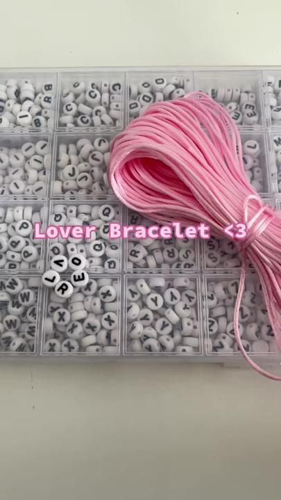 the pink thread is next to some beads