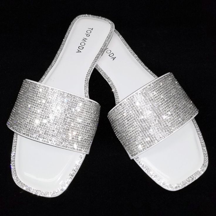 Sparkle In These Blingy White Slip On Sandals New In Box Man Made Material Silver Crystal Encrusted Uppers And Shoe Edges Slip On Style Lightly Padded Insole Comfy Flat Heels Fitting: True To Size. Silver Sandals Flat, Sparkly Chanclas, Sparkly Flip Flops, White Sliders, Nike Shoes Blue, Jeweled Flats, Sparkle Sandals, White Slippers, Pretty Sandals