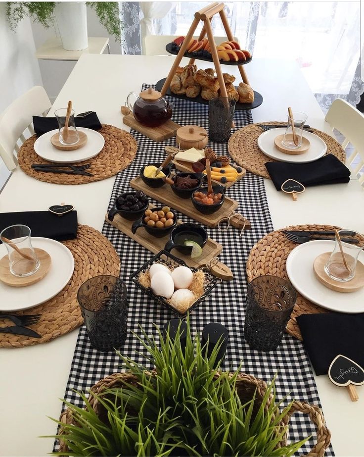 the table is set with plates, bowls and cups