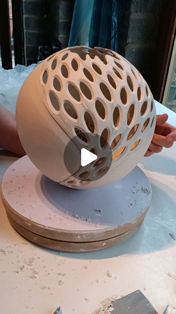 a person is working on a sculpture in the process of making it look like an egg