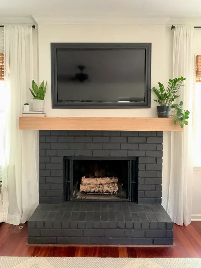 a fireplace with a flat screen tv above it