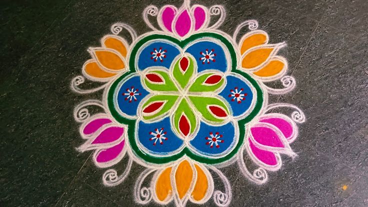 a colorful flower design painted on the ground