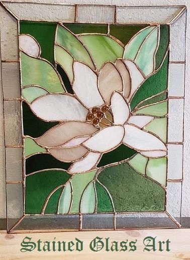 a stained glass window with a flower on it