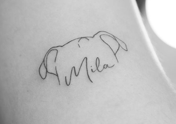 an elephant tattoo with the word mia on it