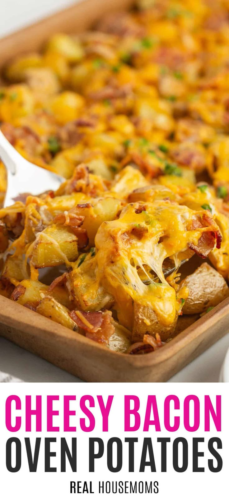 the cheesy bacon oven potatoes are ready to be eaten and served in the casserole dish