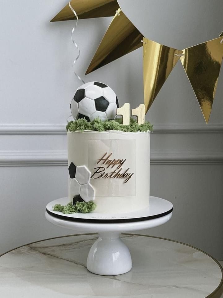 a soccer themed birthday cake on a table