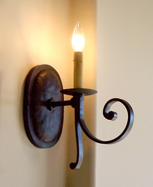 Classic wrought iron sconces make ordinary walls a focal point. Interior Sconces, Mexican Lighting, Wrought Iron Light Fixtures, Lamp Drawing, Wrought Iron Lights, Custom Light Fixtures, Wrought Iron Decor, Sconces Living Room, Wrought Iron Candle