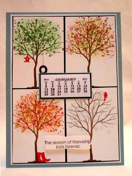 a calendar with four different trees on it