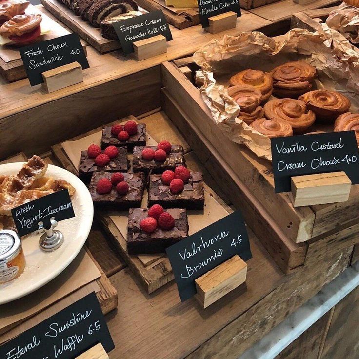 various pastries and desserts on display at a bakery