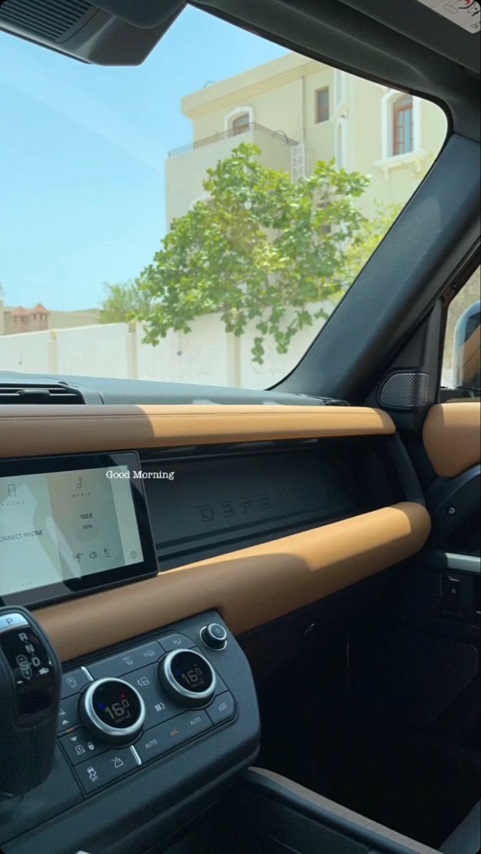 the interior of a car with tan leather trim