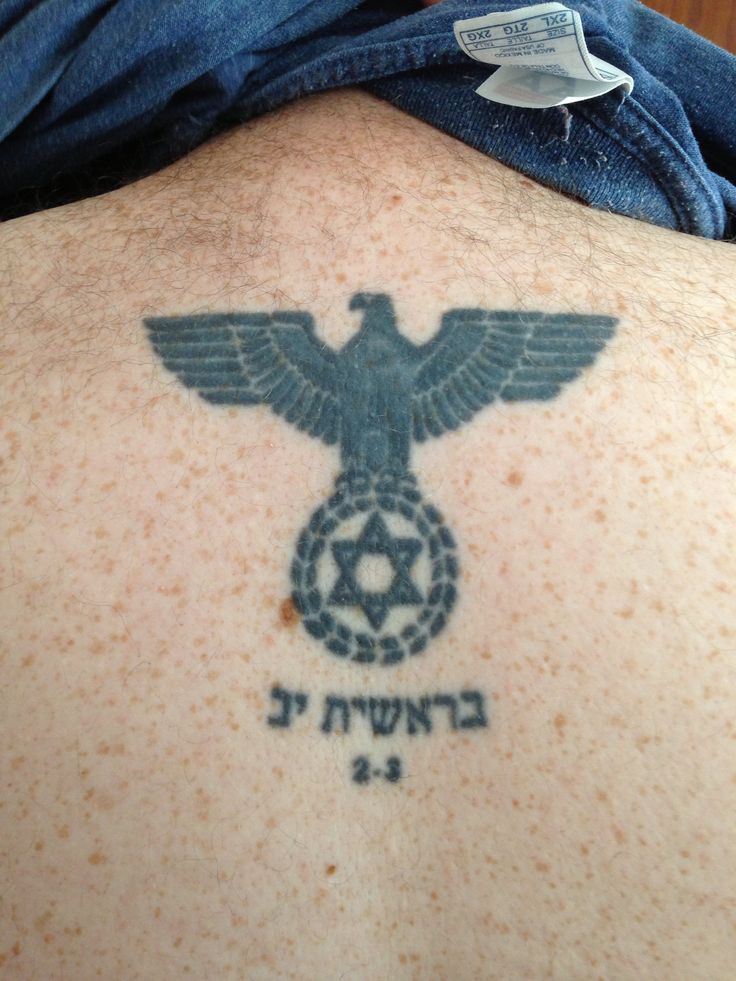 the back of a man's chest with an eagle and star of david tattoo on it