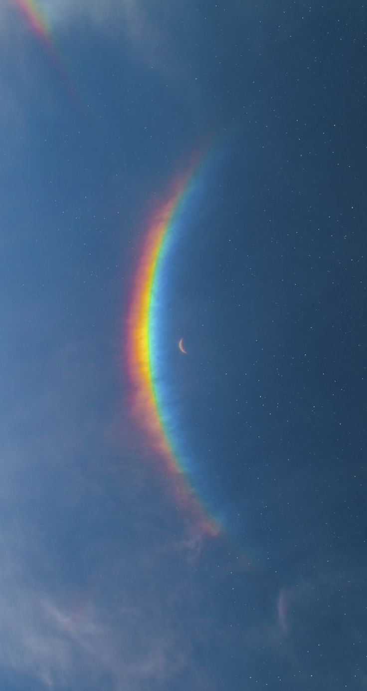 a rainbow colored ring in the sky