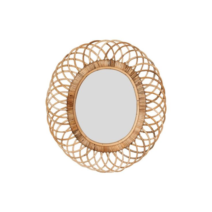 a round mirror sitting on top of a white wall