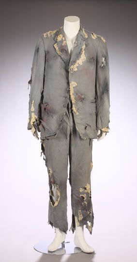 an old suit with torn paint on it