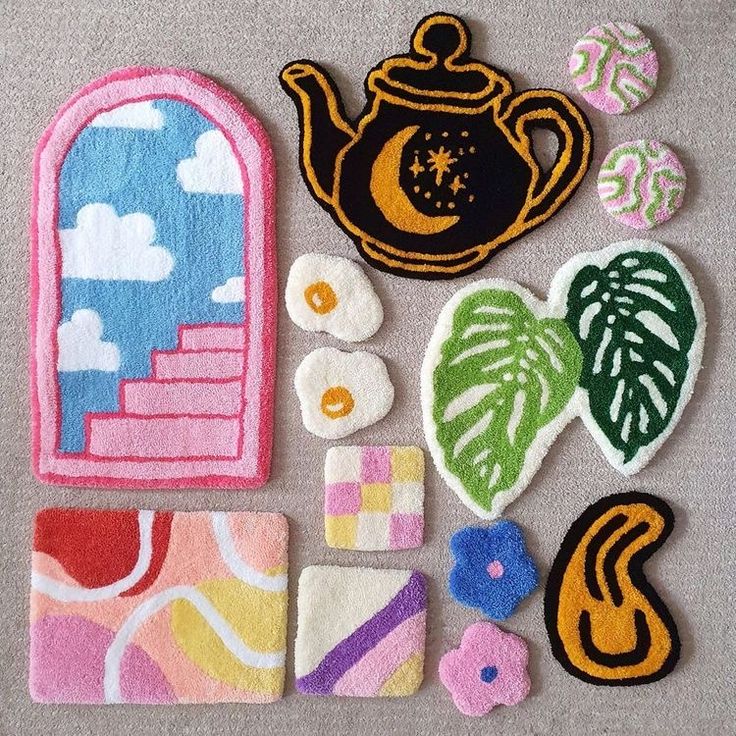 various patches and magnets are arranged on a table top, including a teapot