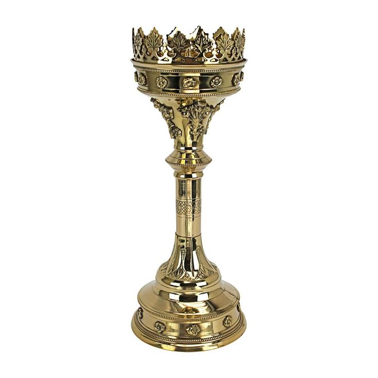 a golden cup with a crown on top is sitting in front of a white background