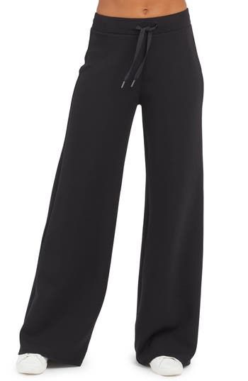 These throw-on-and-go pants is made from spacer fabric that's engineered with a cushiony feel that's as light as air. 30" inseam, 26" leg opening, 12" front rise, 15" back rise (size medium) Elastic/drawstring waist 47% modal, 46% polyester, 7% elastane Machine wash, tumble dry Imported Wide Comfy Pants, Black Womens Dress Pants, Straight Leg Sweat Pants, Black Comfy Pants, Sweat Pants Aesthetic, Winter Workout Clothes, Open Leg Sweatpants, Black Baggy Sweatpants, Trending Pants