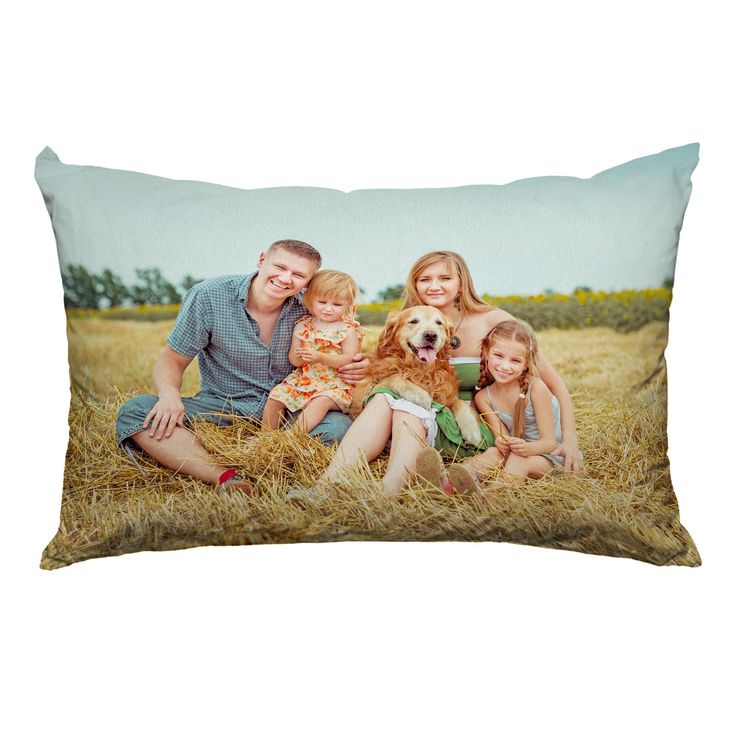 a family photo on a pillow with a dog and three children sitting in the grass