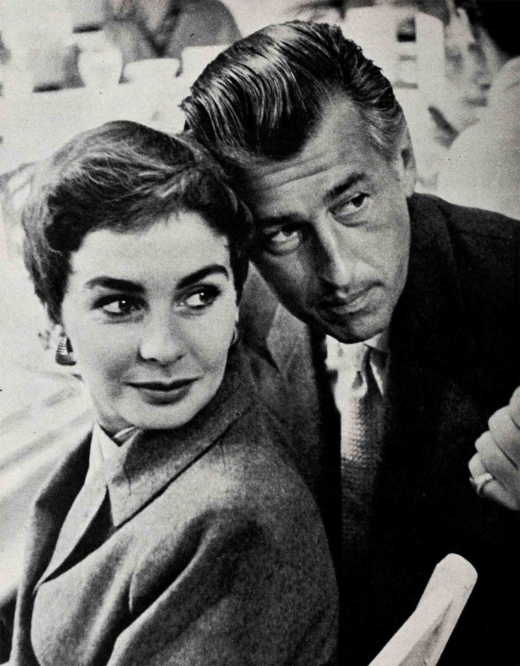 an old black and white photo of two people