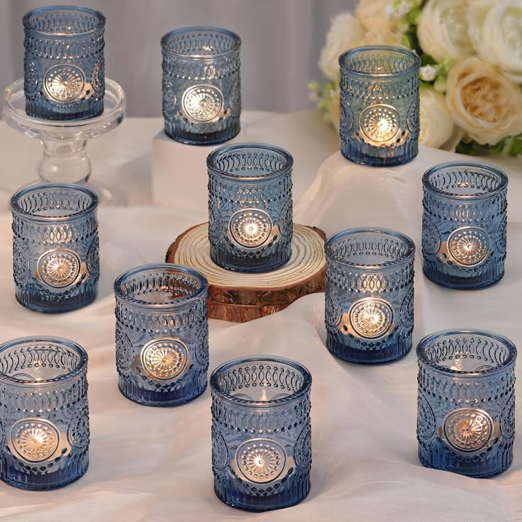 PRICES MAY VARY. ❤️❤️[ Votive Candle Holders Set ]❤️❤️: You will get 36 pack blue votive candle holders in your package, measuring 2.1ʺ diameter and 2.56ʺ height approximately, can be used with regular votive candles, tea light candle, and flameless LED tea waxes less than 1.5" in diameter.(Candles Excluded). These glass votive candle holders are the perfect complement to any dining table, which can be used with regular votive candles, tea light candles, flameless LED tea waxes, and edible butte Light Blue Candles Wedding, Wedding Table Setting With Candles, Reception Food Table Decorations, Blue Green Wedding Centerpieces, Dusty Blue Candles, Dusty Blue And Gold Wedding Theme Table Settings, All Shades Of Blue Wedding, Wedding Table Decorations Blue And White, Dusty Blue Wedding Theme Table Settings Centerpieces