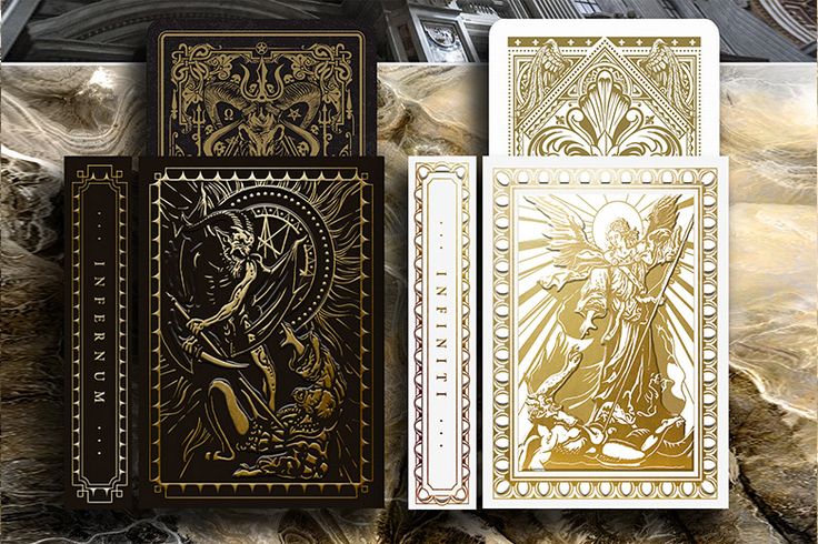 four gold and white playing cards in front of a building