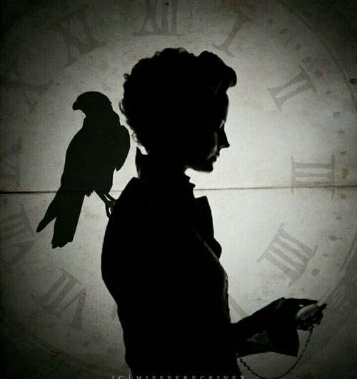 a woman standing in front of a clock with a bird on her arm