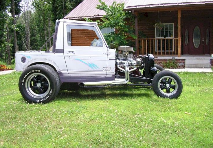 an older model truck parked in front of a house