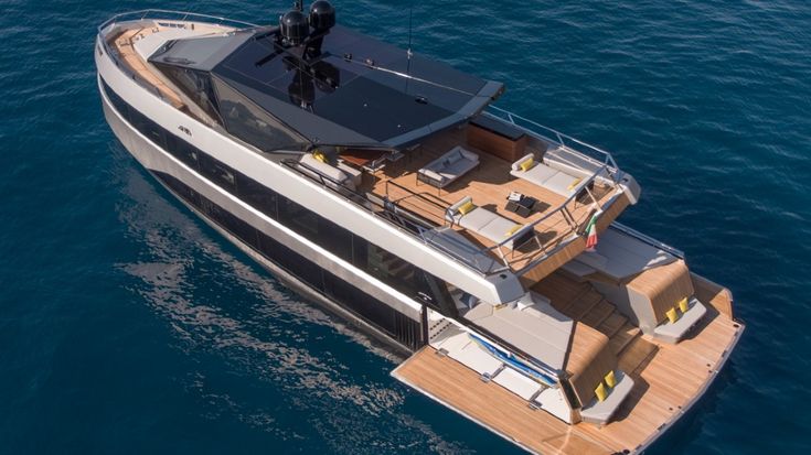 an aerial view of a boat in the water with its deck extended and sunroofed