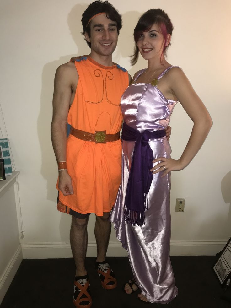 a man and woman dressed up in costumes