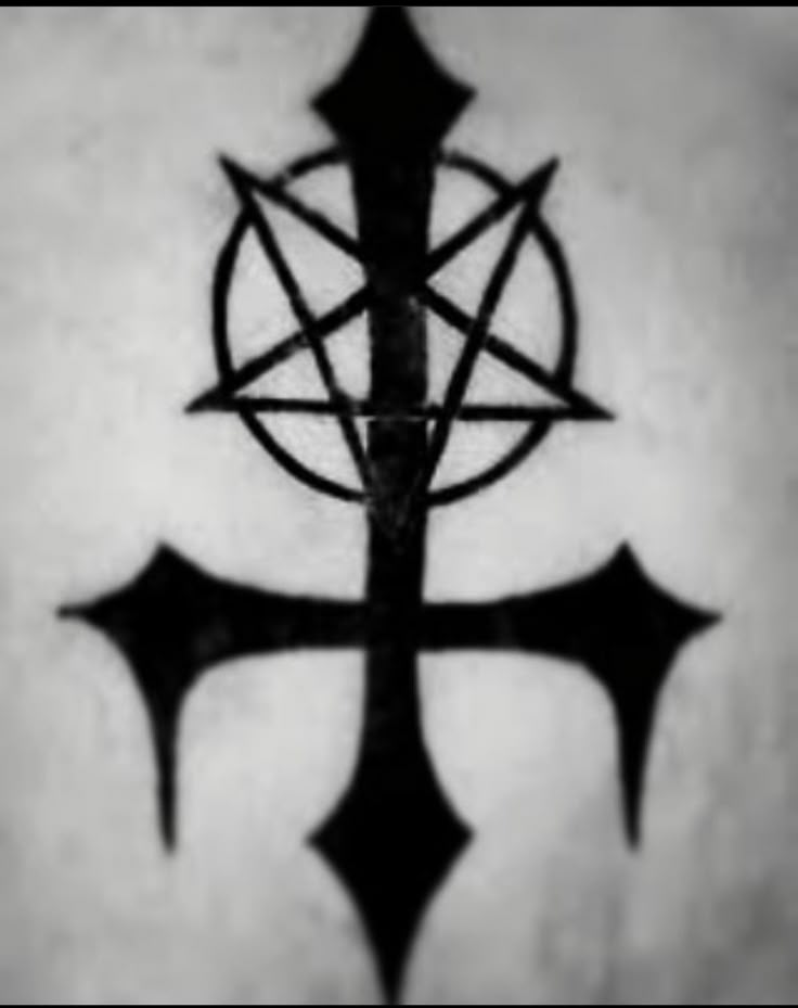 a black and white photo of an inverted cross with two pointed crosses on the side