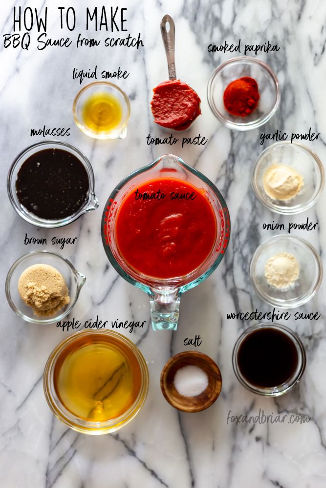 the ingredients for homemade bbq sauce in small bowls on a marble countertop with text overlay