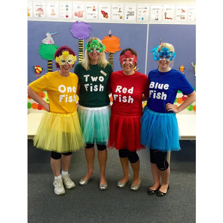 three girls in costumes standing next to each other