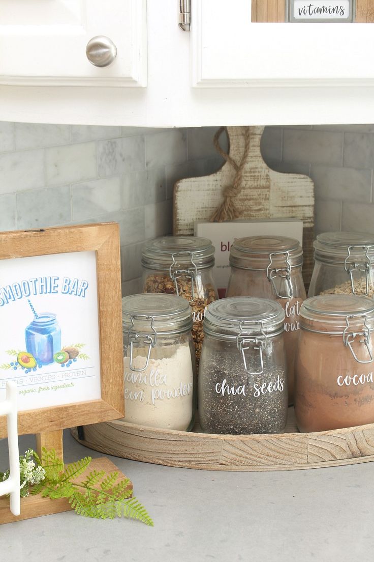 there are many jars in the kitchen on the counter and one has a sign that says good time baby