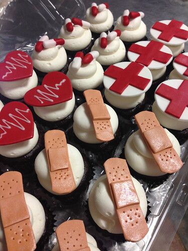 cupcakes decorated with red crosses and hearts