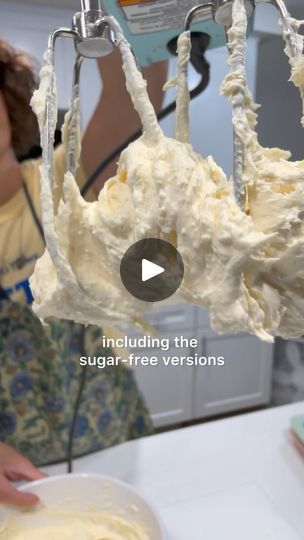 a woman is mixing some food in a bowl