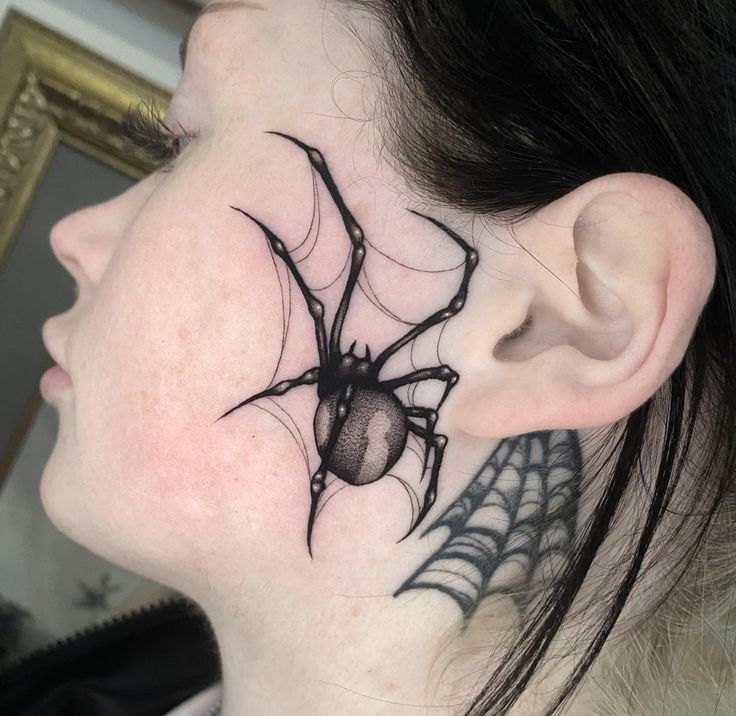 a woman with a spider tattoo on her neck and behind the ear is a spider