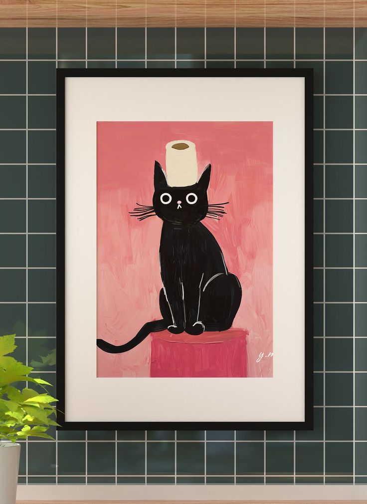 a black cat sitting on top of a table next to a potted plant